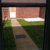 Photo 3: Garden at the back of the property. The door seen in the photo leads to the parking barn