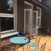 Photo 4: Balcony. Flat is facing the back of the house.