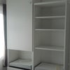 Photo 2: Floor to ceiling storage with shelves and drawers