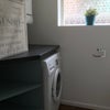 Photo 2: Downstairs toilet/laundry room