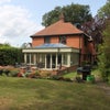 Photo 2: Side of house with patio