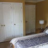 Photo 6: Bedroom showing wardrobes and door