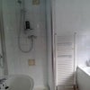 Photo 6: Upstairs Bathroom With Bath Shower and Toilet