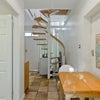 Photo 2: Breakfast area and stairs to bedroom