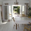 Photo 2: the dining area and extension leading onto the decking and garden