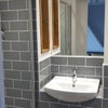 Photo 4: Ensuite with shower, wc, shelving and heated towel rail