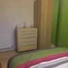 Photo 2: a spacious room with storage