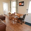 Photo 3: TV room with leather sofa dining table & chairs