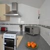 Photo 6: kitchen microwave, cooker, 2 fridgefreezers, washing machine
