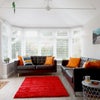 Photo 4: Comfortable bright lounge area with TV