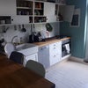 Photo 4: The kitchen ? out of view is the fridge and cabinet full of kitchenware and cookery books.