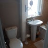 Photo 8: The toilet ? has a bath to the side.