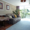 Photo 2: The living room has a great view...