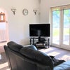 Photo 3: Spacious living room over looking lakeside scenes