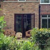 Photo 7: The house and decking seen from the back of the garden