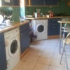 Photo 2: the kitchen with washer and dryer