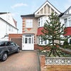 Photo 9: The front of the house. Off street parking subject to availability 