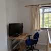 Photo 7: TV and desk with chair