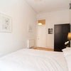 Photo 8: front room (unavailable) black wardrobe has been replaced with big white double wardrobe