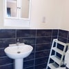 Photo 4: Ensuite bathroom with toilet, sink, and shower box