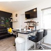 Photo 3: Shared Kitchen diner with snug and TV