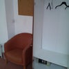 Photo 5: wardrobe doors open and chair