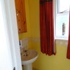 Photo 7: There is a downstairs toilet with handbasin