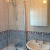 Photo 3: One of the bathrooms, with a shower over the bath combination