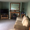Photo 2: Front room - wood burner, TV with satellite.