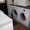 Photo 9: Utility room with washing machine, tumble drier and freezer