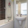 Photo 6: Bathroom with shower and tub
