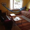 Photo 1: Living room with hammock and view to Arthur's Seat.
