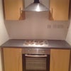 Photo 4: The kitchen, also with Victorian floor tiles