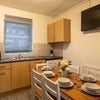 Photo 4: Communal Kitchen with Cupboard and Fridge