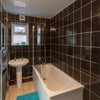 Photo 7: Communal Toilet and Bathtub