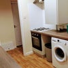 Photo 4: kitchen with washer/dryer 