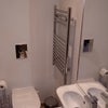 Photo 6: Clean, modern ensuite with toilet, sink and towel rail