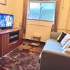 Photo 4: Lounge room (sole use)