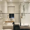 Photo 3: Modern bathroom with creature comforts that will help you relax after a day in the office.