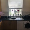 Photo 4: The kitchen comfortably supports the preparation and serving of meals.