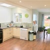 Photo 2: Large open plan communal space with range cooker