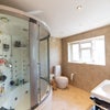 Photo 5: The main bathroom with big shower / bath and streaming massage jets