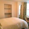 Photo 2: Double bed with shelving system