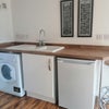 Photo 4: Well equipped kitchen with washer dryer