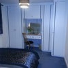 Photo 2: Storage includes 2 double wardrobes with shelves, desk/dresser & drawer & book shelves