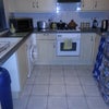 Photo 5: Kitchen with gas cooker / electric fan oven / fridge freezer / gas boiler & washing machine