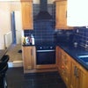 Photo 3: Kitchen with integrated dishwasher and washing machine