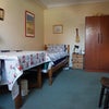 Photo 1: Bedroom view. Single bed, table and chairs, ample storage