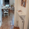 Photo 5:  the hallway with a view into the living room.