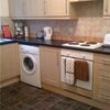 Photo 7: Shared kitchen with washing machine